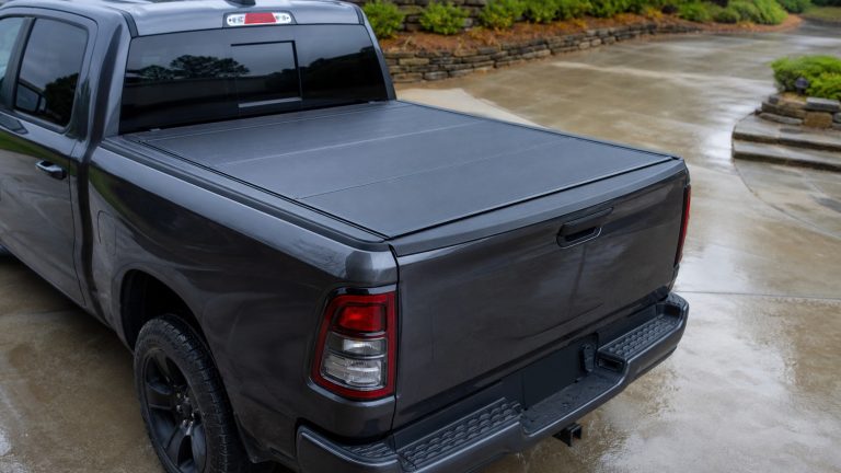 Ram 1500 low-profile tonneau cover showing rail fit and tailgate seal.
