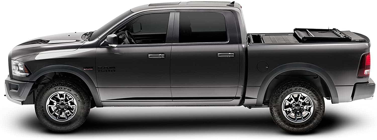Outdoor truck-bed cover setup for cargo and weather checks.